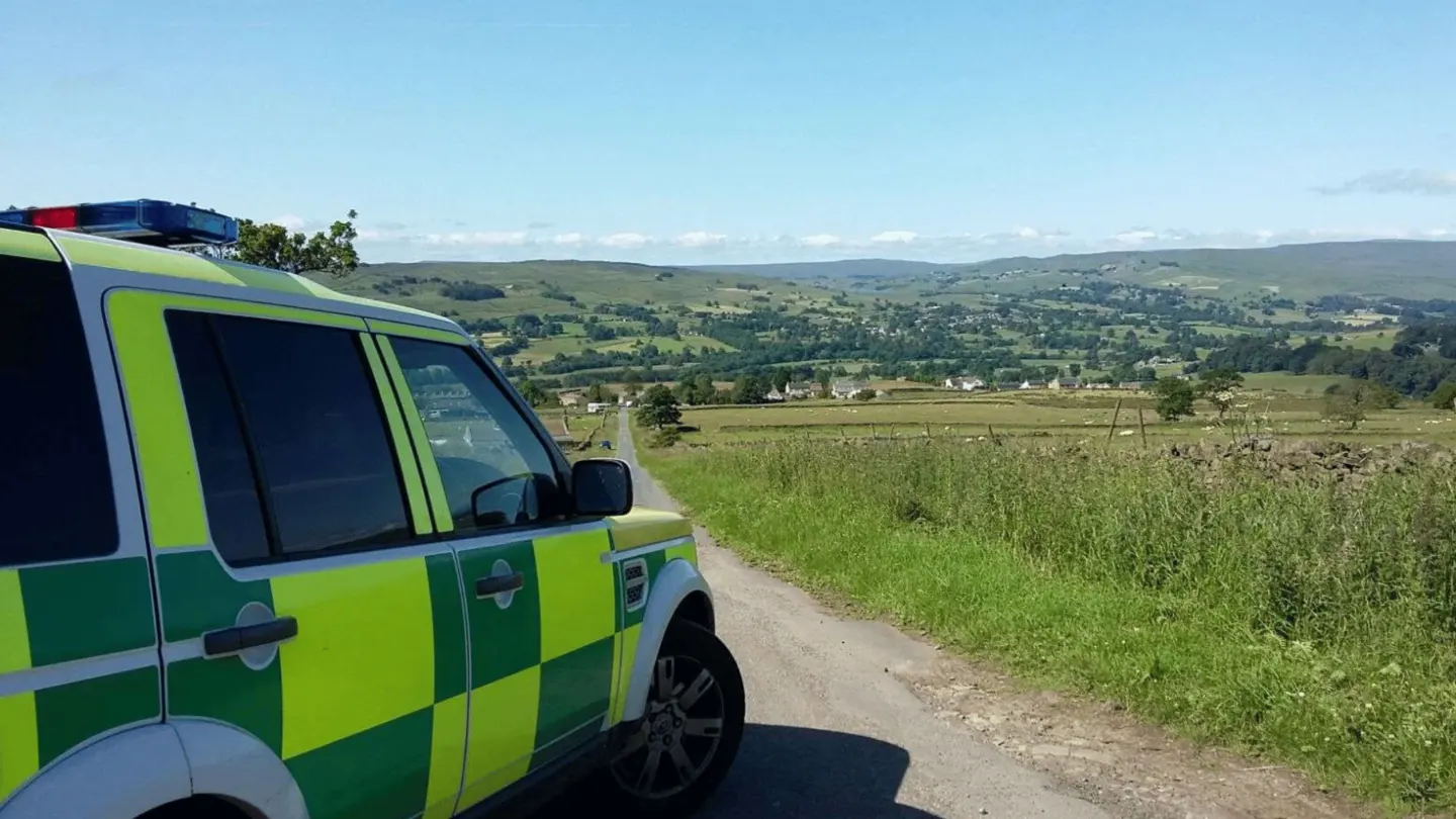 Ambulance response vehicle overlooking open countryside